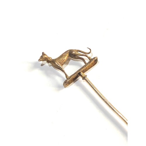 20 - high carat  Gold greyhound stick pin measures approx 9.5cm long, his piece is in good overall condit... 