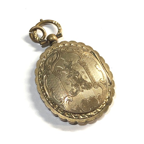 139 - low grade Gold Antique locket pendant xrt tested as 6 ct gold measures approx 42mm by 30mm