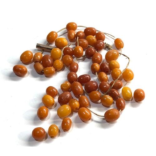 136 - egg yolk amber bead necklace need restringing weight 11g