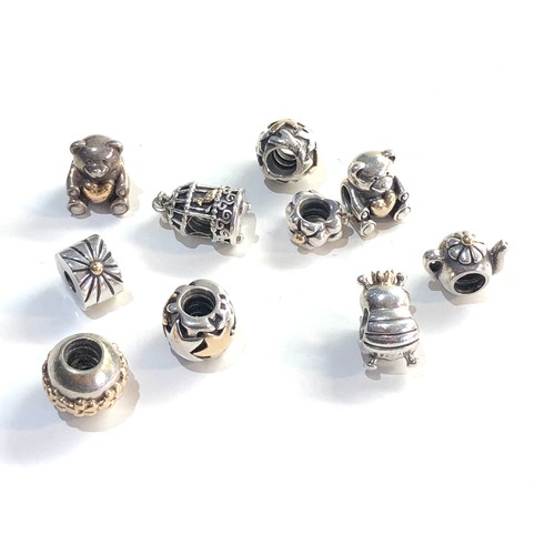 357 - 10 silver  pandora charms some are silver and gold