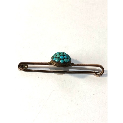 143 - 9ct gold turquoise brooch metal pin turquoise head has been made into a brooch measures approx 5cm w... 