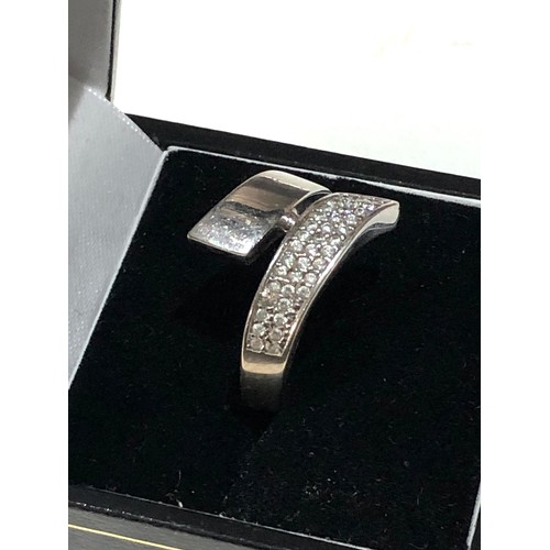 195 - 18ct gold diamond wrap ring 6.6g