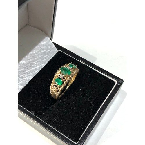 142 - 9ct gold diamond and emerald ring 3.1g