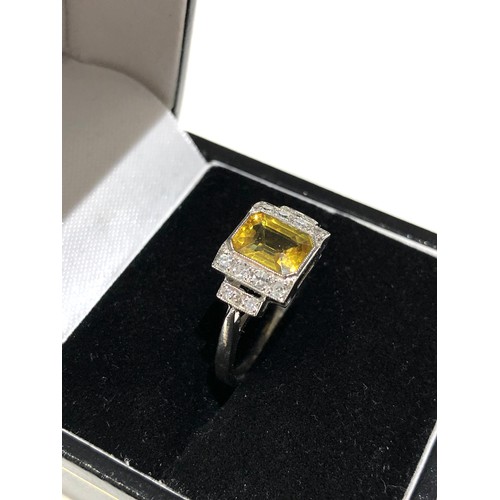 34 - Fine platinum diamond and yellow sapphire ring central yellow sapphire measures approx 7mm by 5.5mm