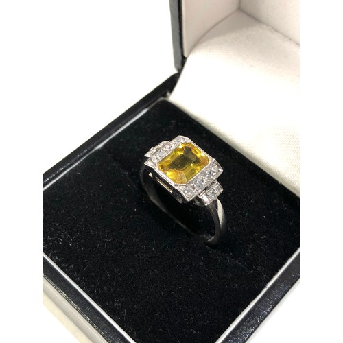 34 - Fine platinum diamond and yellow sapphire ring central yellow sapphire measures approx 7mm by 5.5mm