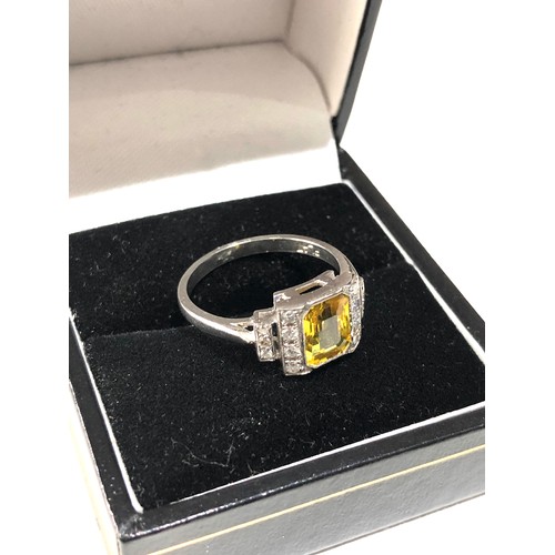 34 - Fine platinum diamond and yellow sapphire ring central yellow sapphire measures approx 7mm by 5.5mm