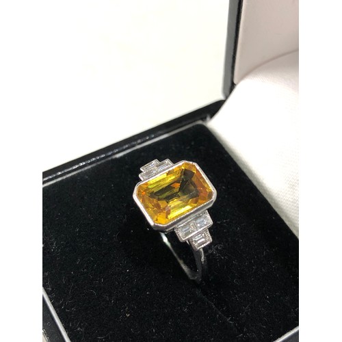 35 - Fine platinum diamond and yellow sapphire ring central yellow sapphire measures approx 11mm by 7mm