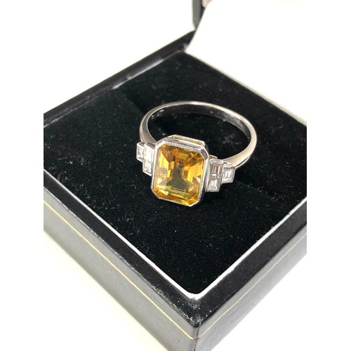 35 - Fine platinum diamond and yellow sapphire ring central yellow sapphire measures approx 11mm by 7mm