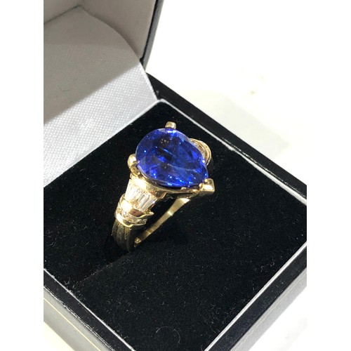 47 - Fine 18ct gold diamond and pear 12mm tanzanite ring central tanzanite measures approx 12mm by 10mm w... 