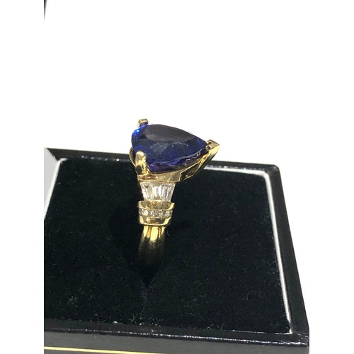 47 - Fine 18ct gold diamond and pear 12mm tanzanite ring central tanzanite measures approx 12mm by 10mm w... 