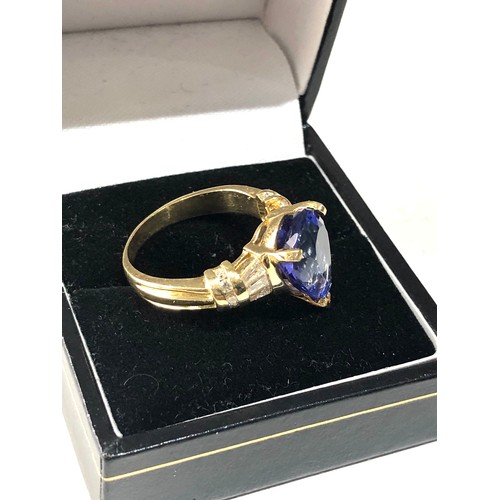 47 - Fine 18ct gold diamond and pear 12mm tanzanite ring central tanzanite measures approx 12mm by 10mm w... 