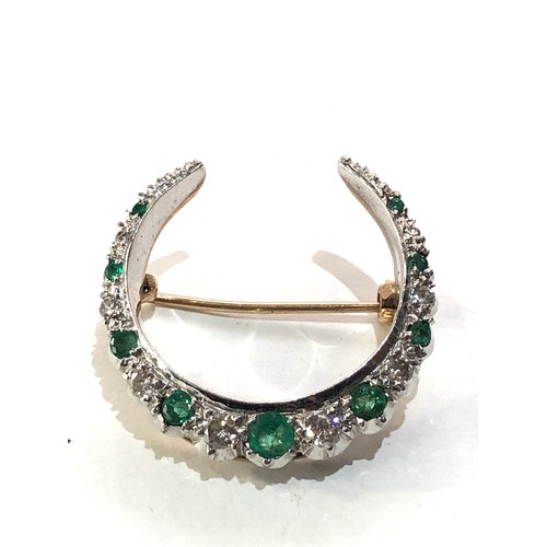 63 - Vintage gold Diamond and emerald crescent brooch measures approx 2.8cm by 2.7cm weight 7g