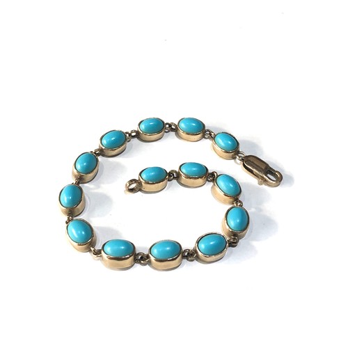 72 - 9ct gold turquoise stone set bracelet measures approx  20cm long 7mm wide weight 13.2g