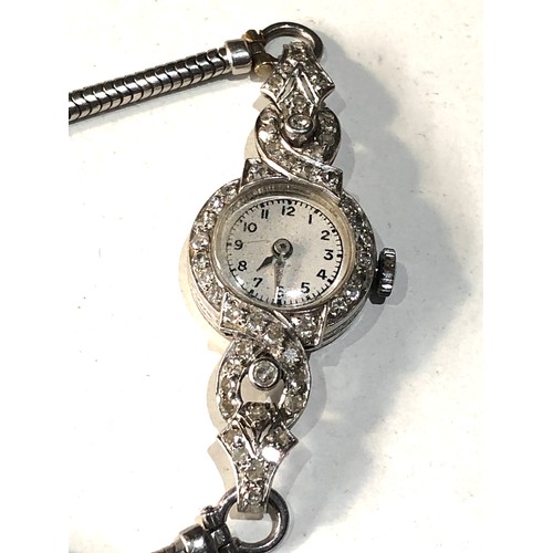 73 - Art deco platinum and diamond cocktail watch weight 16.6g watch winds and ticks but no warranty is g... 