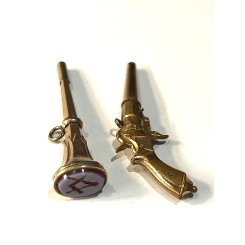 92 - 2 antique novelty watch keys includes gun and a masonic hard stone intaglio