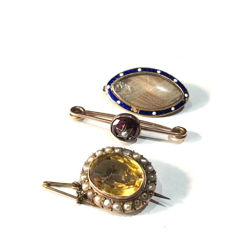 94 - 3 antique gold brooches includes gold and enamel mourning brooch missing pin and crack to glass , Ci... 