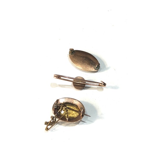 94 - 3 antique gold brooches includes gold and enamel mourning brooch missing pin and crack to glass , Ci... 