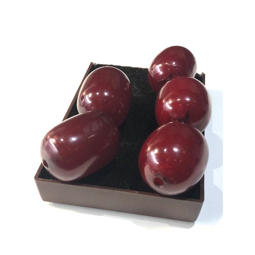 41 - 5 large cherry amber / bakelite beads measure approx 30mm by 22mm weight 52g good internal swirls