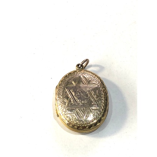 259 - Antique gold bk - front locket measures approx 3cm by 2.2cm