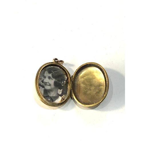 259 - Antique gold bk - front locket measures approx 3cm by 2.2cm