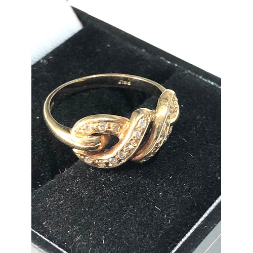 115 - 18ct gold diamond Infinity ring 4.2g