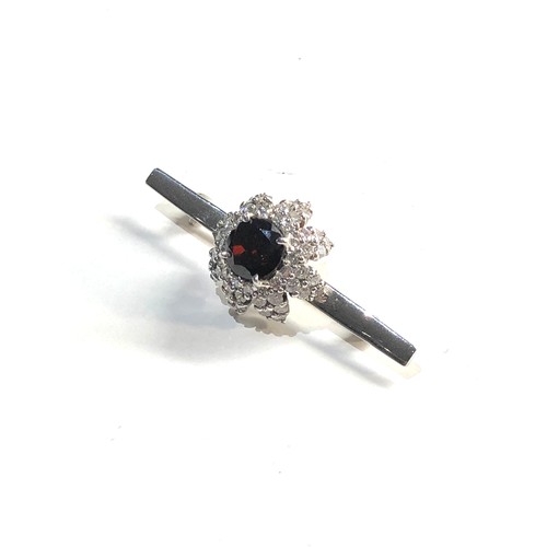 163 - 18ct white gold diamond and stone set  brooch weight 8.13g