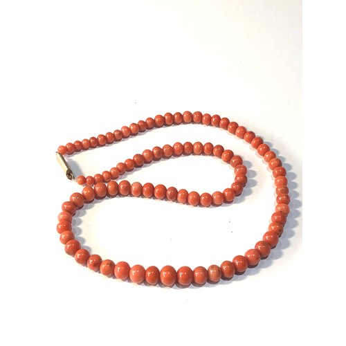 238 - Antique coral bead necklace graduated largest coral bead measures approx 9mm by 7mm total weight 33g