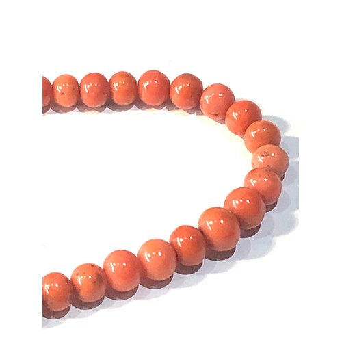 238 - Antique coral bead necklace graduated largest coral bead measures approx 9mm by 7mm total weight 33g