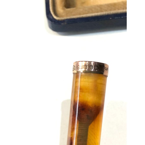 191 - Large boxed amber and 9ct gold rim cheroot / cigarette holder measures approx 15cm long and in origi... 