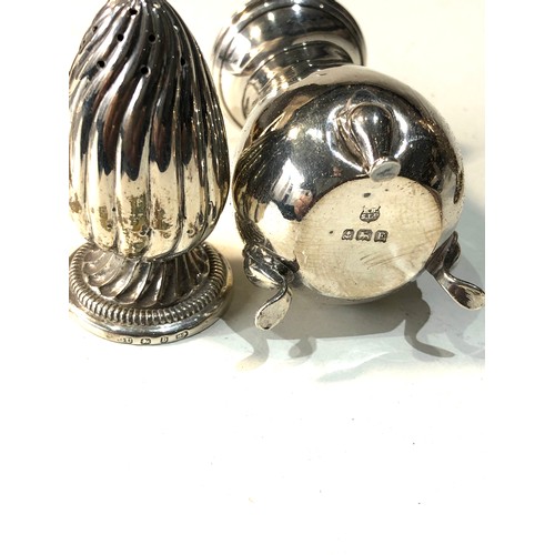 62 - Selection of silver items includes 2 silver peppers and salts