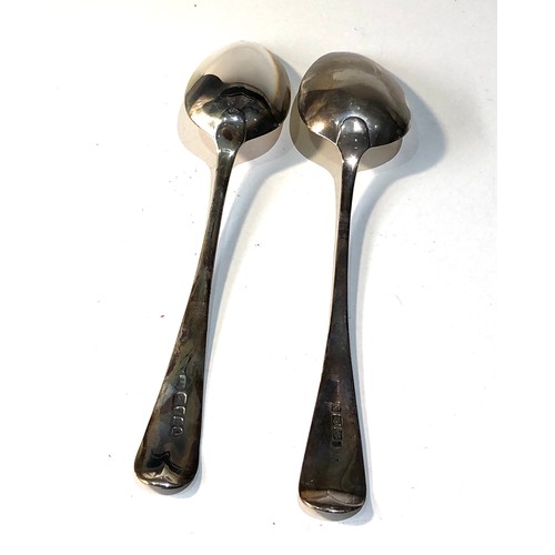 17 - 2 large Georgian silver serving spoons measure approx 23cm london silver hallmarks total weight 106g