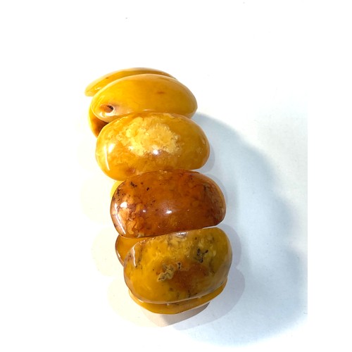 213 - Egg yolk amber bracelet each panel measures approx 4.2cm by 2.6cm wide weight 57g