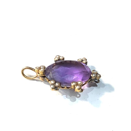 193 - Antique 15ct gold amethyst and seed-pearl pendant measures approx 2.5cm drop by 1.7cm wide