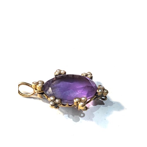 193 - Antique 15ct gold amethyst and seed-pearl pendant measures approx 2.5cm drop by 1.7cm wide