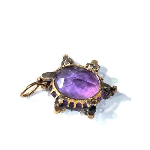 193 - Antique 15ct gold amethyst and seed-pearl pendant measures approx 2.5cm drop by 1.7cm wide