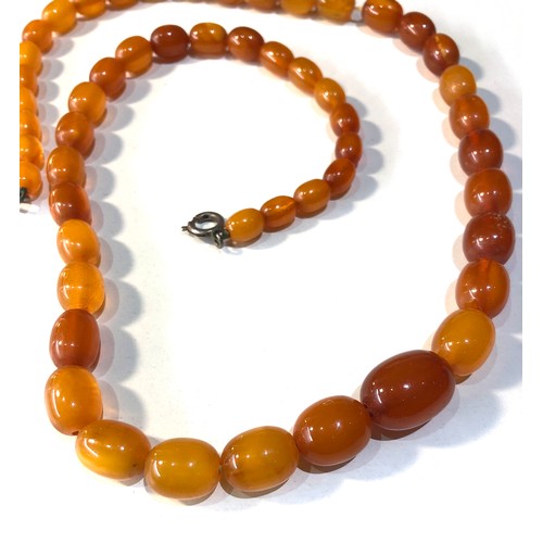 172 - Antique egg yolk amber bead necklace weight 32g