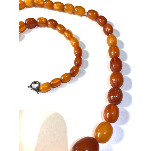 172 - Antique egg yolk amber bead necklace weight 32g