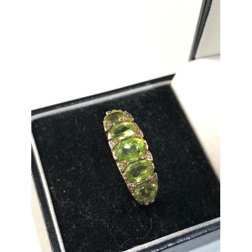 150 - 9ct gold peridot diamond ring 5.8g