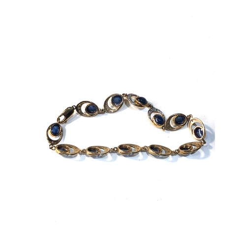 142 - 9ct gold diamond and sapphire bracelet 10.7g