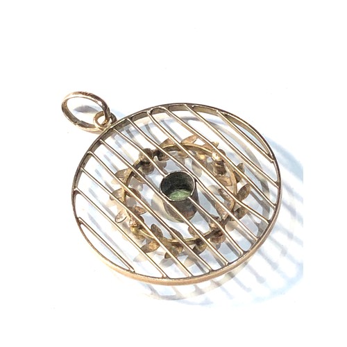 112 - Antique 9ct gold peridot and seed-pearl pendant measures approx 2.8cm dia