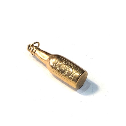 97 - 9ct gold bottle of guinness charm