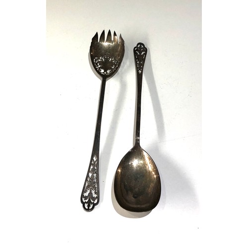 22 - 2 hallmarked Mappin & Webb silver salad serving spoons each measures approx 26cm long weight 100g sh... 
