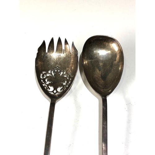 22 - 2 hallmarked Mappin & Webb silver salad serving spoons each measures approx 26cm long weight 100g sh... 
