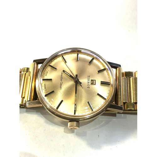 88 - Boxed 9ct gold gents Tissot seastar seven wristwatch in working order and good condition but no warr... 