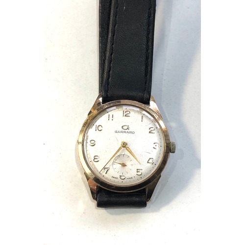 75 - Vintage 9ct gold gents Garrard wristwatch winds and ticks in good used condition but no warranty is ... 