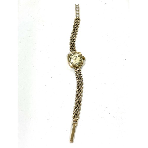 116 - 9ct Gold ladies wrist watch and strap