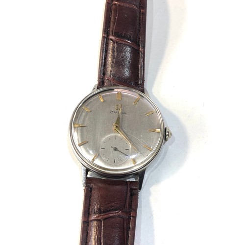 96 - Vintage oversize Omega gents wristwatch silvered dial gold coloured batons case measures approx 34mm... 