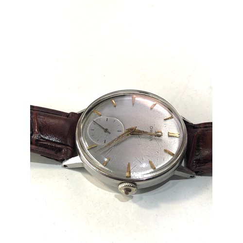 96 - Vintage oversize Omega gents wristwatch silvered dial gold coloured batons case measures approx 34mm... 