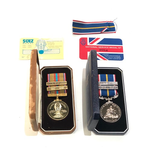 439 - 2 boxed medals inc suiez campaign and national service medals