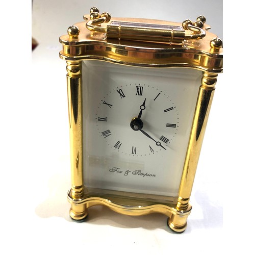 476 - Fine quality brass carriage clock by Fox & Simpson measures approx 12cm tall not including handle wo... 